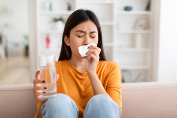 Pregnant young asian woman having nausea and feeling ill