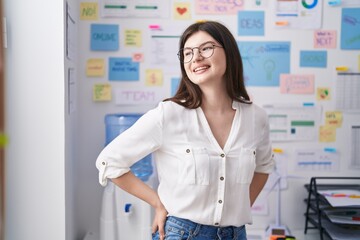 Young caucasian woman business worker smiling confident standing at office