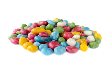 Candy dragees. Pile of colorful candies isolated on a white background. Multi-colored candies isolated on a white background. Heap of multi-colored candies on white.