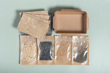 Set for growing sprouts from seeds. Seeds, linen mats, boxes and lids flat lay, top view