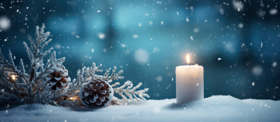 White Christmas candle in front of cold blue background