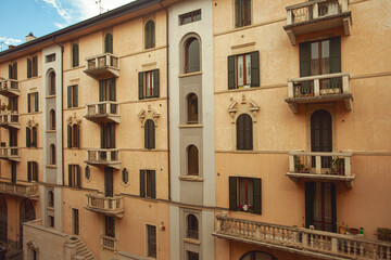 Fototapeta na wymiar Windows of Verona. Traditional italian shutters. Outdoor shot with perspective