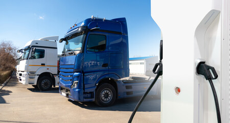 Electric trucks with charging station. Concept.