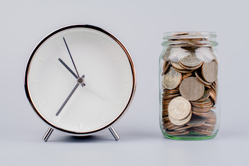 Saving coins in a glass jar money saving concept Finance and banking, mutual funds, cash, cash flow, income, wages, investments, financial growth and investment.