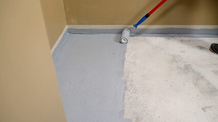 Applying an anti-slip layer to the floor of an underground parking lot. Applying waterproofing and...