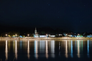 Fototapeta na wymiar Night view of an Austrian village on a Danube river bank. District of Melk, lower Austria