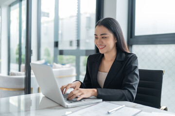 Beautiful Business Woman working by using laptop computer Hands