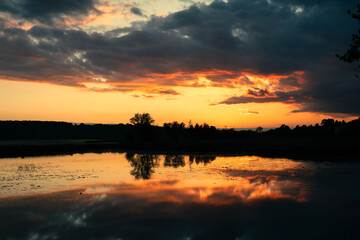 Fototapeta na wymiar Sunset reflected in the lake