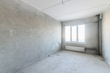 rough repairs for self-finishing. interior decoration, bare walls of the room, stage of construction