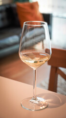White wine in a chic chalice in a livingroom 