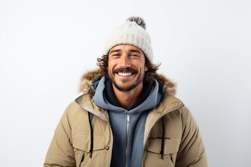 Portrait of a man in winter clothes on white background. Person is wearing hat, jacket, coat, snowboarding gear.