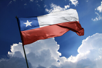 national flag of Chile waving in the wind on a clear day.