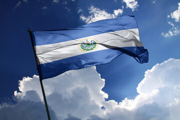 national flag of El Salvador waving in the wind on a clear day.