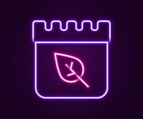 Obraz premium Glowing neon line Calendar with autumn leaves icon isolated on black background. Colorful outline concept. Vector