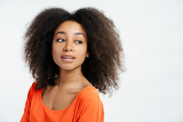 Portrait of beautiful fashion African American model wearing casual brown t shirt looking away