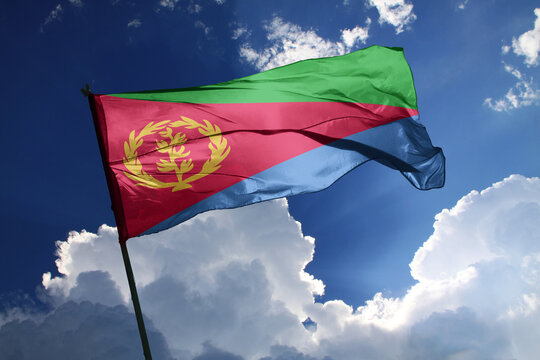 national flag of Eritrea waving in the wind on a clear day.