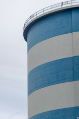 Part of a blue and white large silo