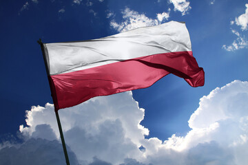 national flag of Poland waving in the wind on a clear day.