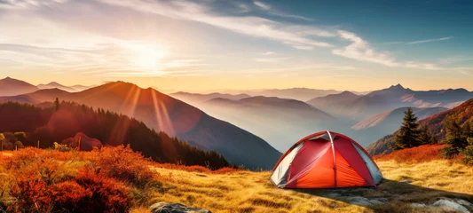 Tuinposter Tourists tent on top of the mountain at sunrise over mountains beautiful landscapes, and autumn mountains, Traveler people enjoying adventure alternative vacation Camping travel fresh air concept © chiew