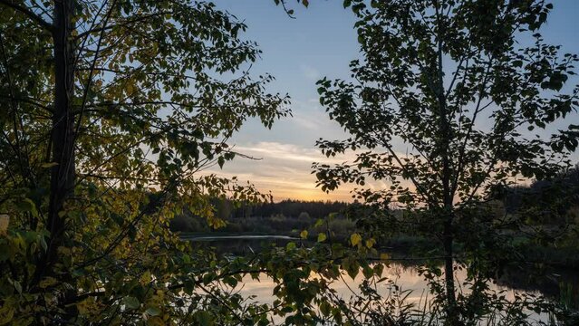 Autumn twilight near a forest lake, beautiful autumn landscape, camera movement, hyperlapse 4k video 4096 2304