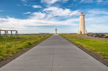 Akranes lighthouses on the west coast of Iceland. Bigger lighthouse is operational and smaller is deactivated old one. White building by the sea
