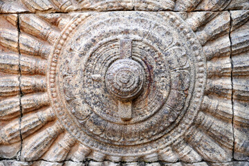 Chariot spoked wheel sculpture in Hindu temple. Stone relief wall carving in Airavatesvara Temple, Darasuram, Kumbakonam, Tamilnadu.