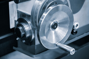 Lathe control knobs close up blue tone. Metal machine tools industry. The metalworking process by turning machine. industry metal processing concept background