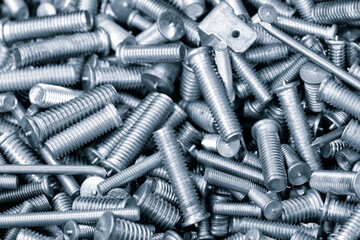 Texture background of metal products screws, nozzles, bolts and studs for welding equipment,...