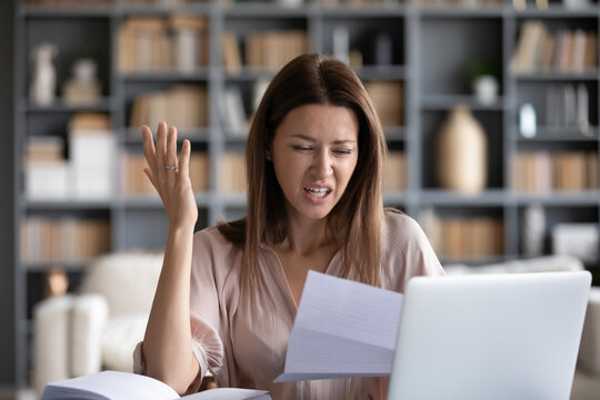 Indignant Woman Reading Letter Sit At Table At Home, Housewife Received Bad News Resented By Utilities Price Go Up, Lessor Raised Cost Of Rented Housing, Debt Notice From Bank, Money Problems Concept