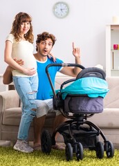 Young parents with baby expecting new arrival