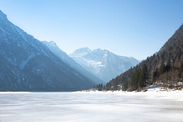 Fototapeta na wymiar Lago del Predil under an ice patch, Udine, Italy