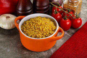 Dry wheat bulgur cereal heap
