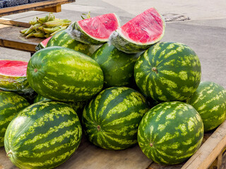 Ripe watermelons in the market - 666159352