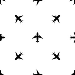 Seamless pattern of repeated black airplane symbols. Elements are evenly spaced and some are rotated. Vector illustration on white background