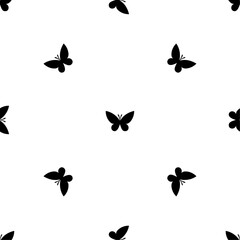 Seamless pattern of repeated black butterfly symbols. Elements are evenly spaced and some are rotated. Vector illustration on white background