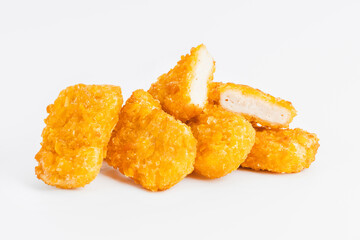 Chicken Breaded Fillet.Fast food. Breaded Chicken Inner Fillet on a White Background,Chicken Breaded Raw Meat. Fast cooking. Breaded chicken nuggets. Homemade food at home.