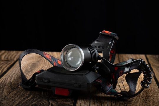 LED headlamp for outdoor use, waterproof, with replaceable batteries.