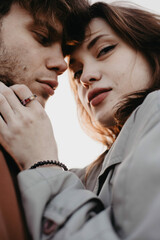 soft focus tenderness of a couple in love close-up, intimacy and tactility.