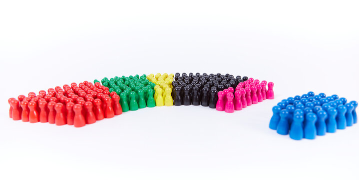wooden figurines in the colors of German political parties and the rotunda of the german parliament, afd (right wing) separated from other parties