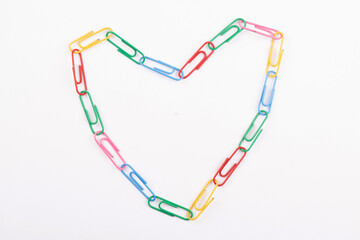 Heart shape paperclip isolated on white background