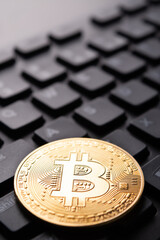 Closeup of cryptocurrency bitcoin on keyboard