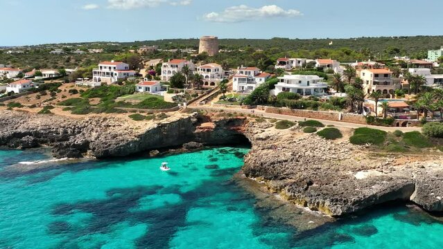 Minorca's rocky coastline and the vibrant residential areas.