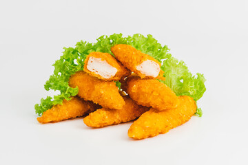 Chicken Breaded Fillet.Fast food. Breaded Chicken Inner Fillet on a White Background,Chicken Breaded Raw Meat. Fast cooking. Breaded chicken nuggets. Homemade food at home.