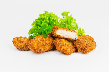 Breaded Chicken Inner Fillet on a White Background,Chicken Breaded Raw Meat.Chicken Breaded Fillet.Fast food. Fast cooking. Breaded chicken nuggets. Homemade food at home.