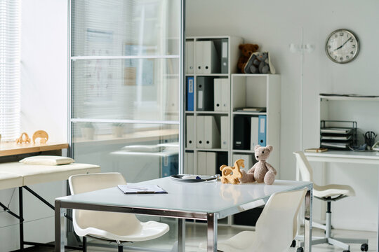 Empty Modern Office Of Pediatrician With Toys On His Workplace