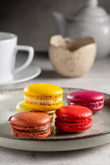 Delicious macaroons on the table. Macarons cakes in different colors.