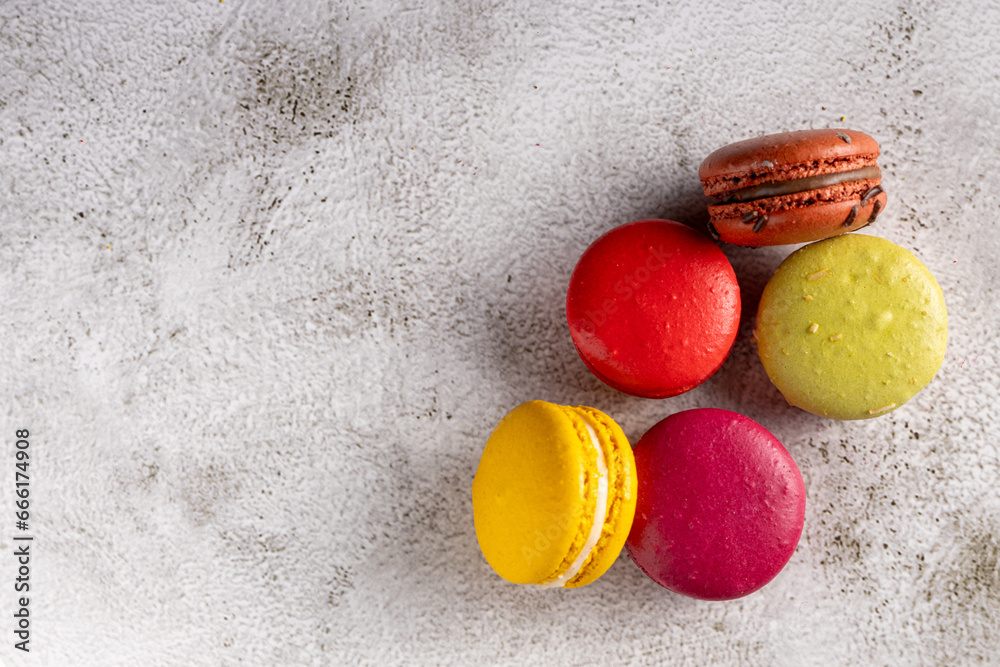 Wall mural delicious macaroons on the table. macarons cakes in different colors.