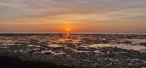 sunrise in early morning hours in egypt close to Marsa alam sun reflexion in the red sea