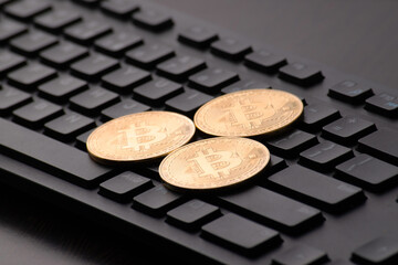 Bunch of bitcoins on keyboard