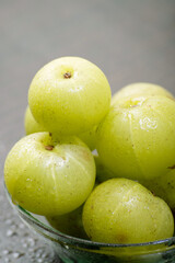 Closeup of gooseberry in bowl, healthy indian fruit amla